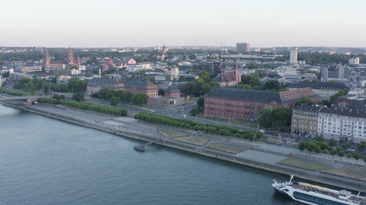 Aerial approach drone View of Mainz Landtag Rhine River, Castle, dom, Theodor Heuss Bridge and Cityscape at Sunset Germany 4k