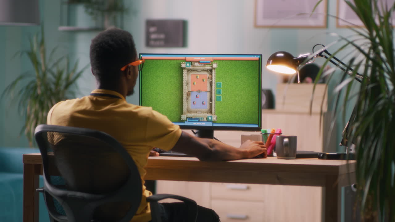 Man Playing a Strategy Video Game