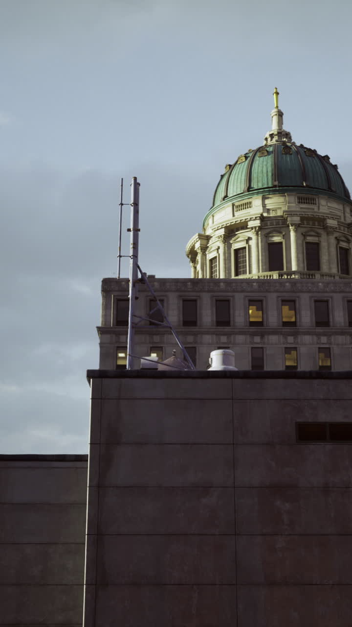 Historic building dome against a moody sky with hints of evening light