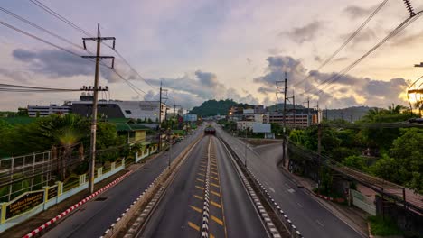 phuket thailand on may 27-2022 time lapse traffic light with traffic on road in phuket city thailand