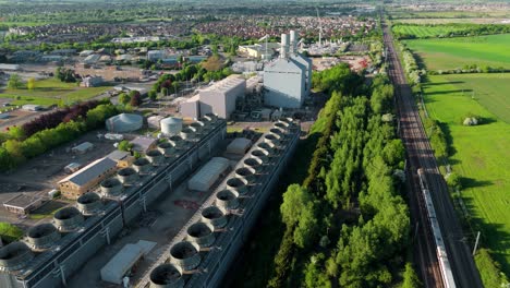 Aerial drone footage of Little Barford Power Station, a modern gas-fired combined cycle power plant located in Bedfordshire, England.