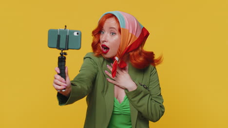 Girl-blogger-take-selfie-on-mobile-phone-selfie-stick-communicate-video-call-online-with-subscribers