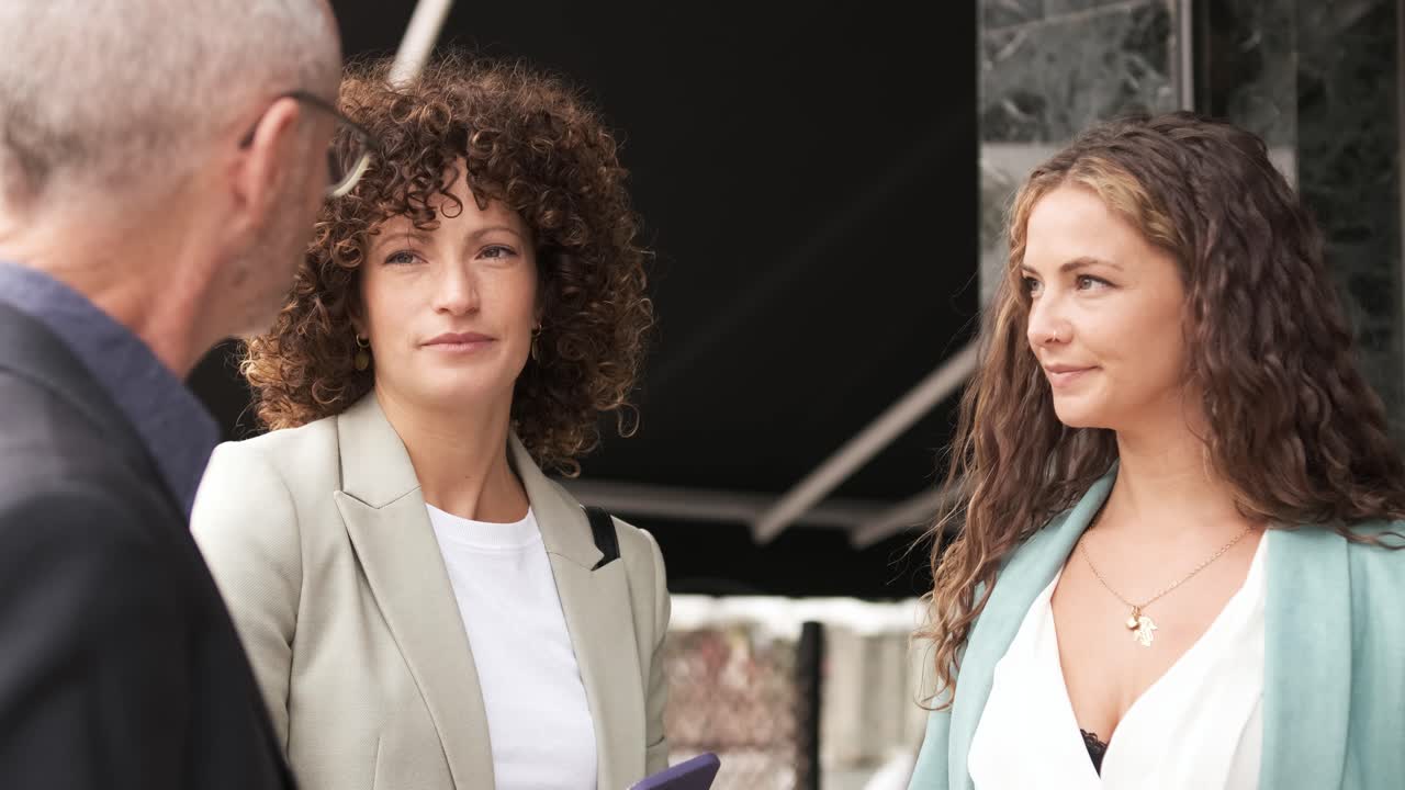 Business people talking while having coffee during break