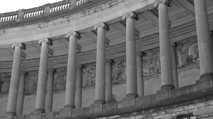 Columns Of The Triumphal Arch And U-shaped Arcade In Cinquantennaire Parc Or Jubelpark In Brussels, Belgium - black and white