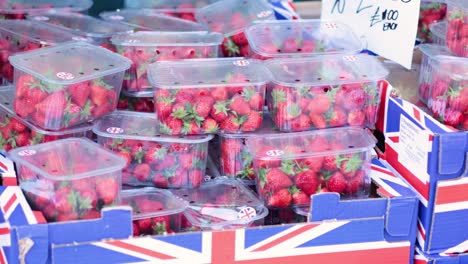 fresh strawberries displayed for sale in cardiff market