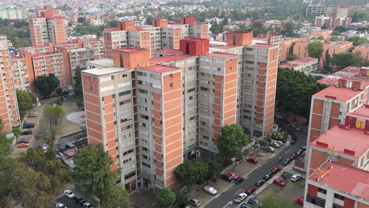 Drone's aerial perspective of red apartment buildings in Mexico City