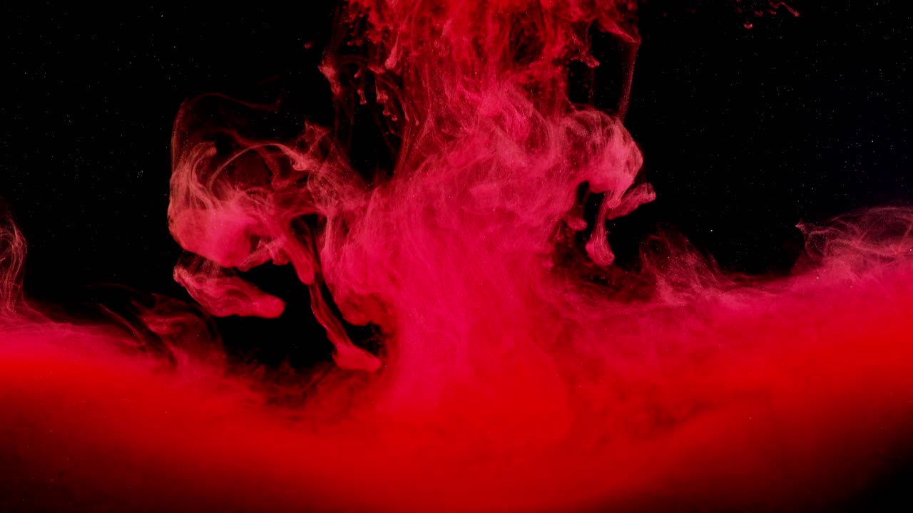 Abstract forms. Shooting on a black background. Mixing of paints