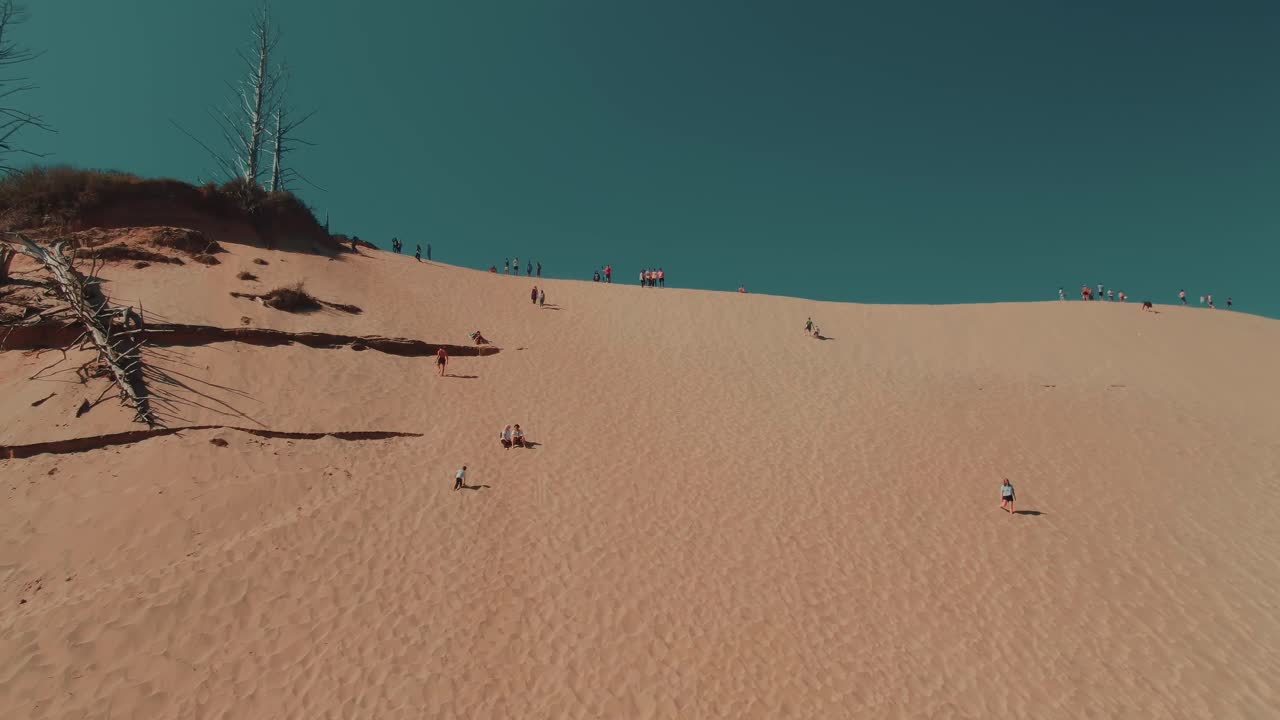 4k Aerial Sand dune with people walking on it