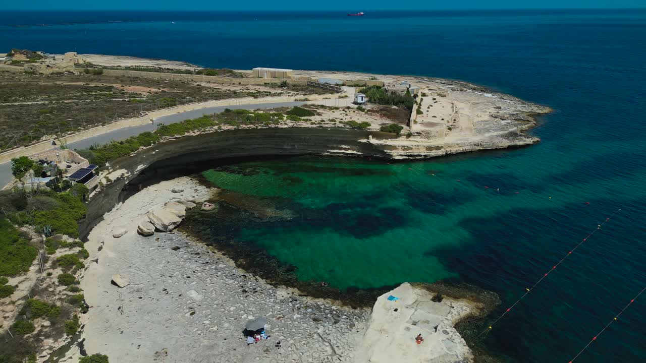 High aerial view approaching Ta' Kalanka Sea Cave, Malta