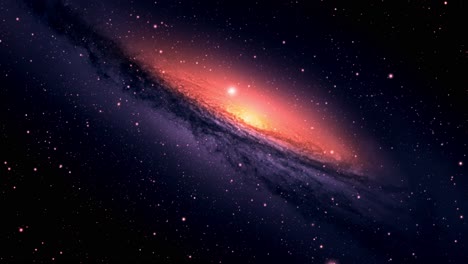 a galaxy with a bright orange light in the middle