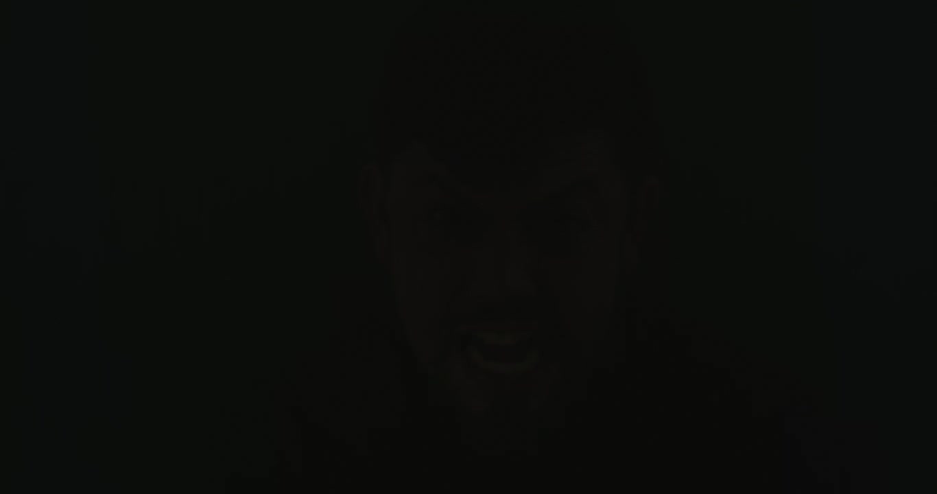 A mad man in flash of dark terror with copyspace
