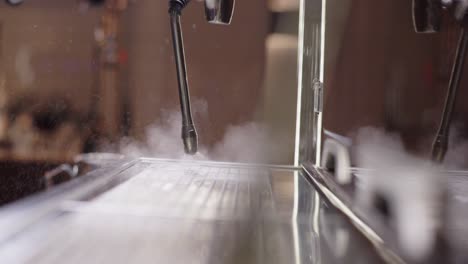 cleaning milk steamer, coffee steamer steaming up lense, coffee machine