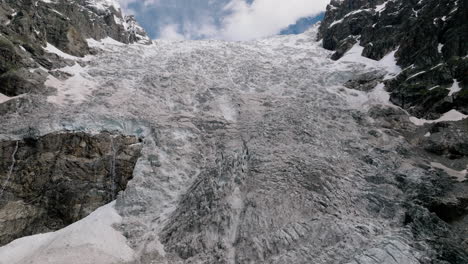 adishi glacier in the greater caucasus mountain range in georgia, svaneti region - aerial drone shot