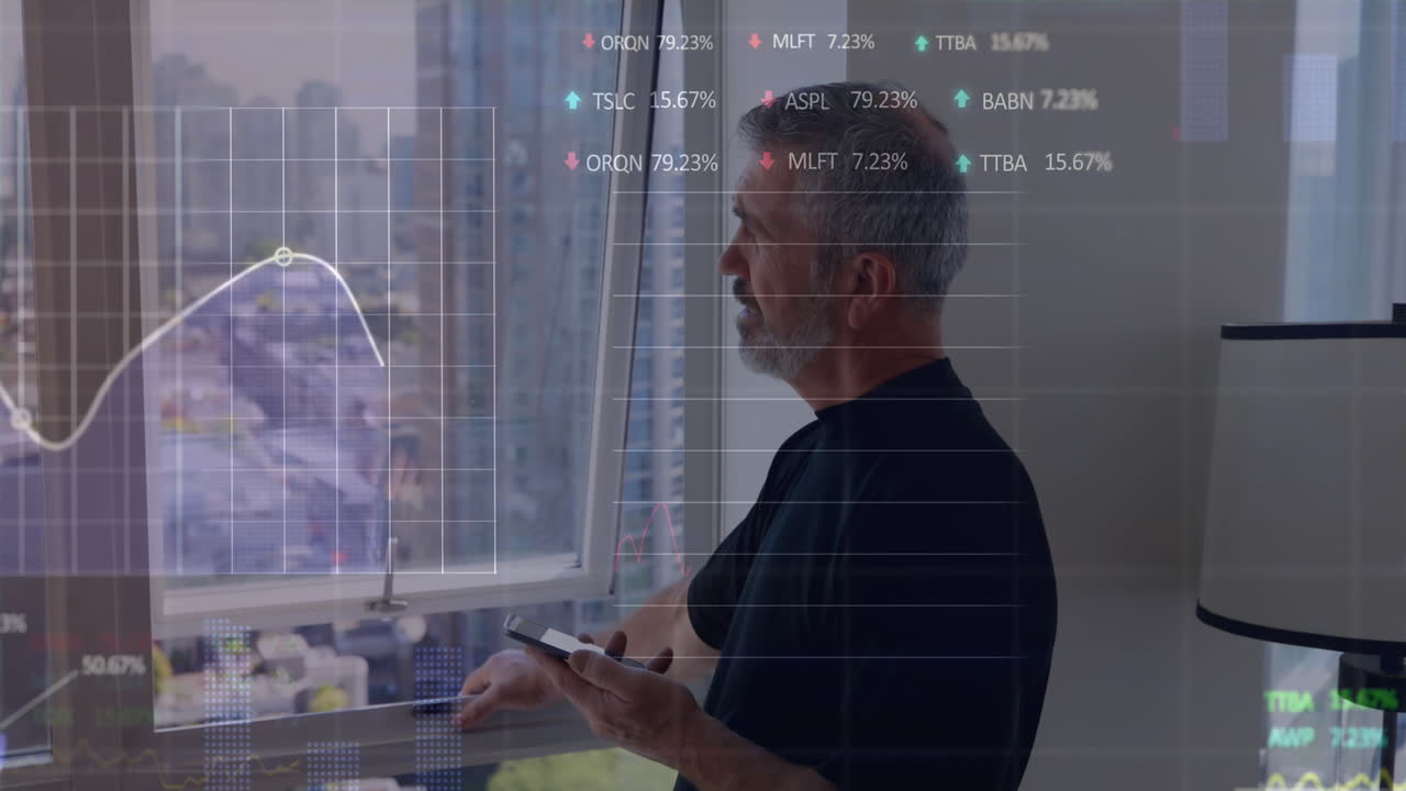 Animation of graphs, trading boards, senior caucasian man standing near window and using smartphone