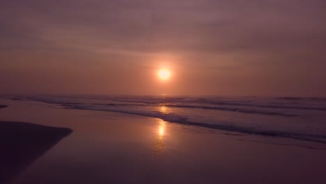 Orange-color-sky-and-ocean-sunset,-aerial-shot,-Brazil