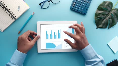 analyzing business data on tablet