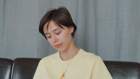 girl taking online lesson via web call at home