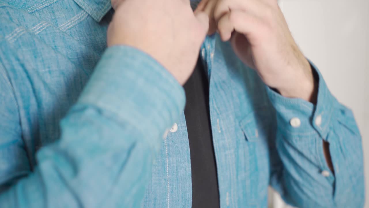 Close-up man squeezing perfume.