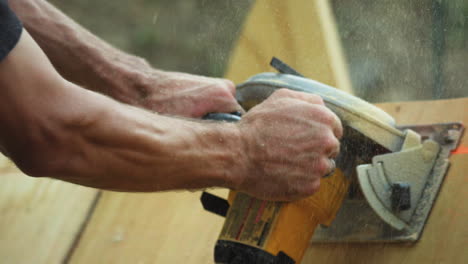 sanding rough surface of a diy skate ramp closeup