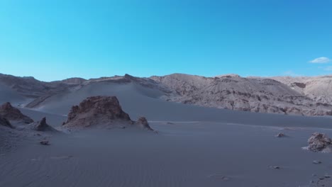 sand dunes and rock formations in the atacama desert, chile, south america