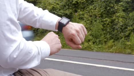 Man-using-his-smart-watch