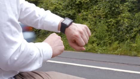 man using his smart watch