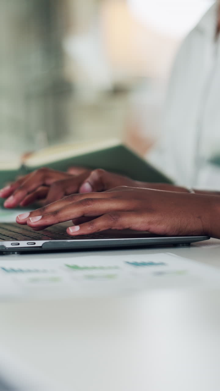 Typing on a laptop for business analytics