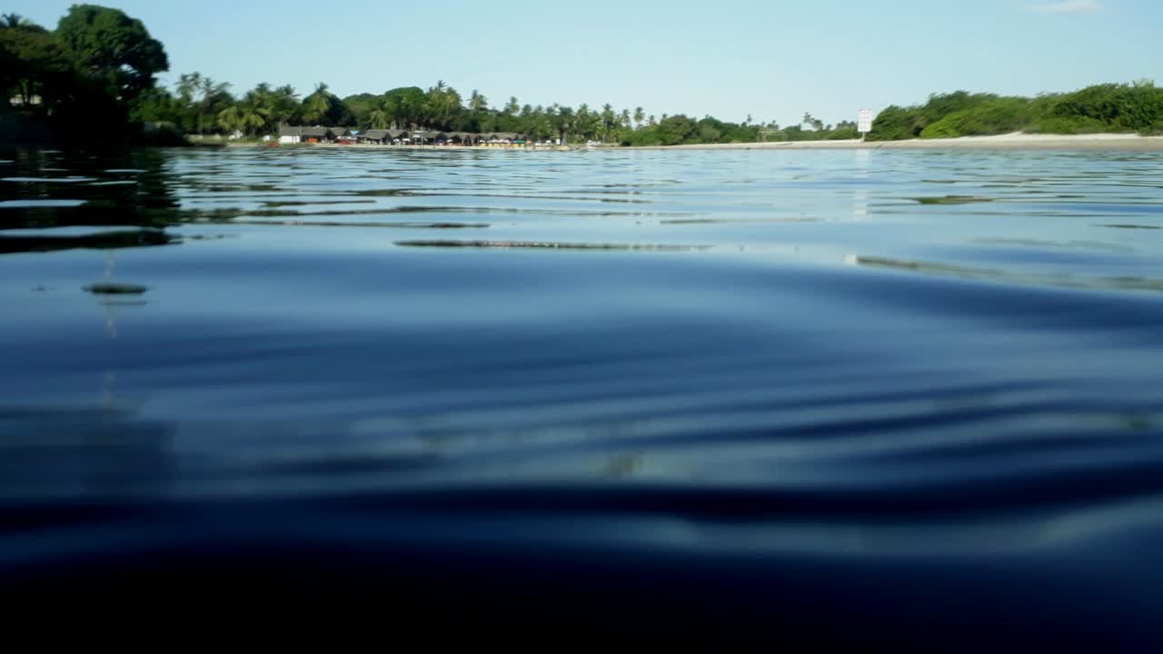 Sailing On A Blue Ocean With Reflections In Summertime. Closeup, Macro
