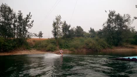 man wakeboarding in the river 4k