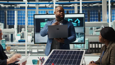 investors in photovoltaics plant analyze market trends on laptop