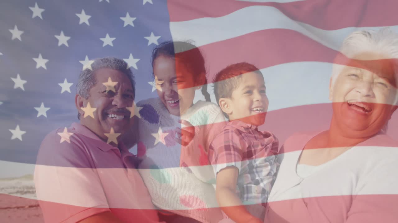animación de la bandera de los estados unidos de américa sobre una pareja biracial con nietos en la playa.