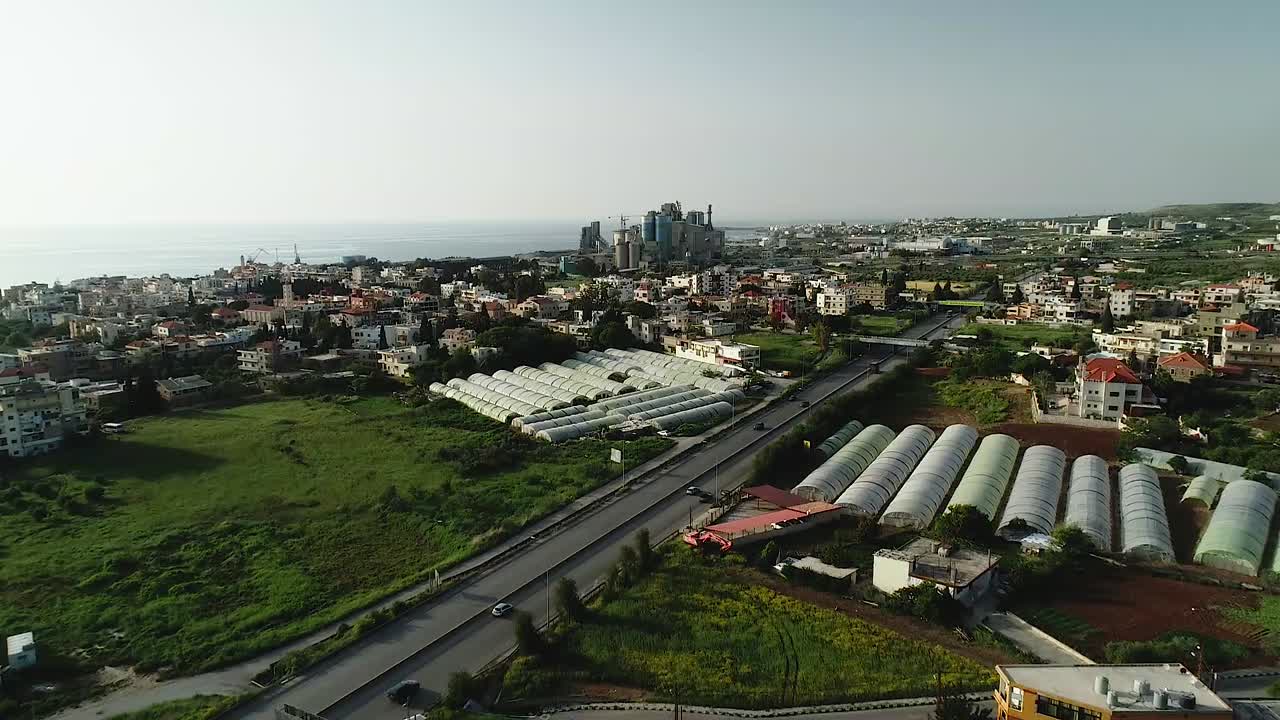 Aerial drone panoramic view of Chekka toward downtown and ocean, North Lebanon
