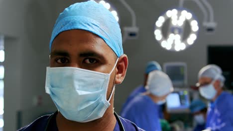 male surgeon standing in the operation theater 4k