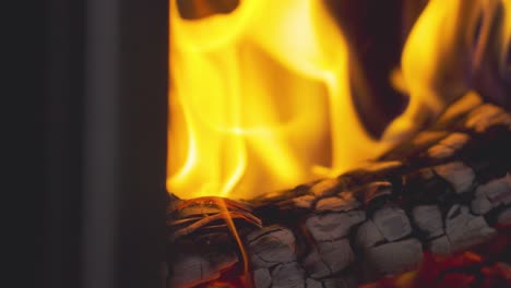 close up flames from fire made from logs in wood burning stove at home 18