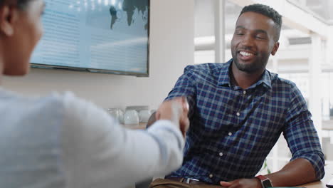 successful job interview african american businessman shaking hands with intern in meeting congratulations for new career opportunity in corporate office