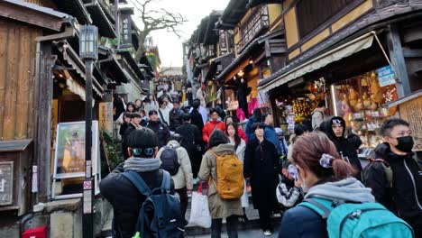 crowded street with tourists and traditional shops