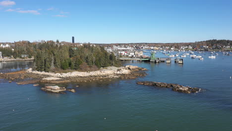 aerial reveal fly by drone footage over vinalhaven ferry terminal, fox islands, knox county, maine, usa