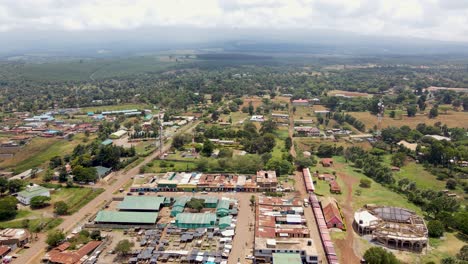 Aerial-drone-view-Open-Air-market-in-the-Loitokitok-town,-Kenya-and-mount-Kilimanjaro--Rural-village-of-Kenya