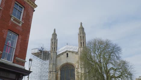 large glass windows of stone cathedral under construction in cambridge england