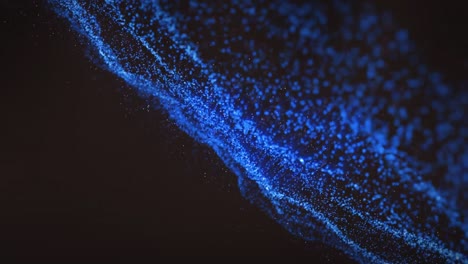 animation of blue wave of spots on black background