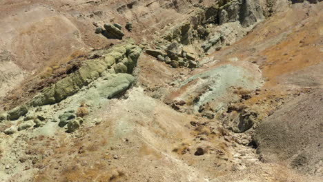 flying through the bottom of one of the rocky and ancient valleys that form the rainbow basin in the mojave desert