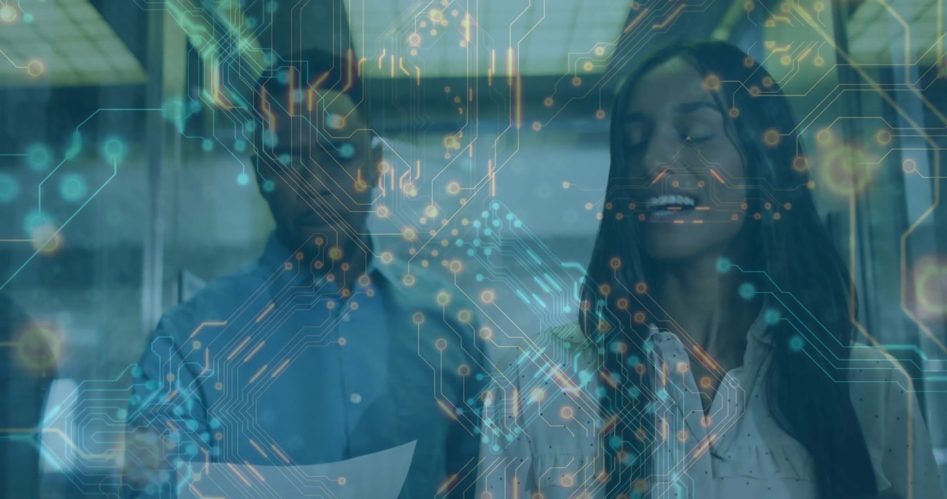 Woman and man reviewing tech diagram walking down corridor collaborating activating circuit overlay