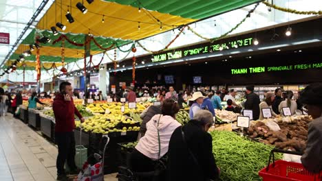 shoppers browsing fresh produce at springvale market