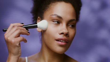 woman applying makeup