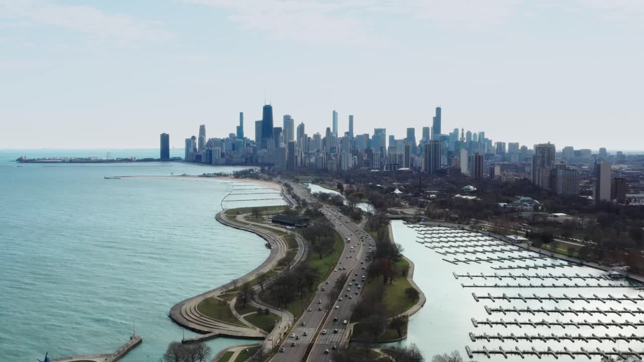 Stunning aerial view of Chicago Downtown, empty Diversey Harbor and US Highway 41 on sunny autumn day during midday traffic