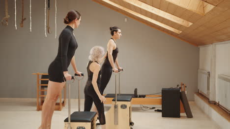 pilates reformer workout session with women