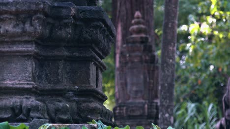 slider shot of khmer stone face carvings near angkor wat