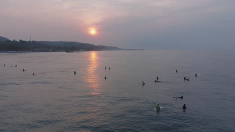 aerial drone view of la bocana surfers el tunco el salvador at sunrise