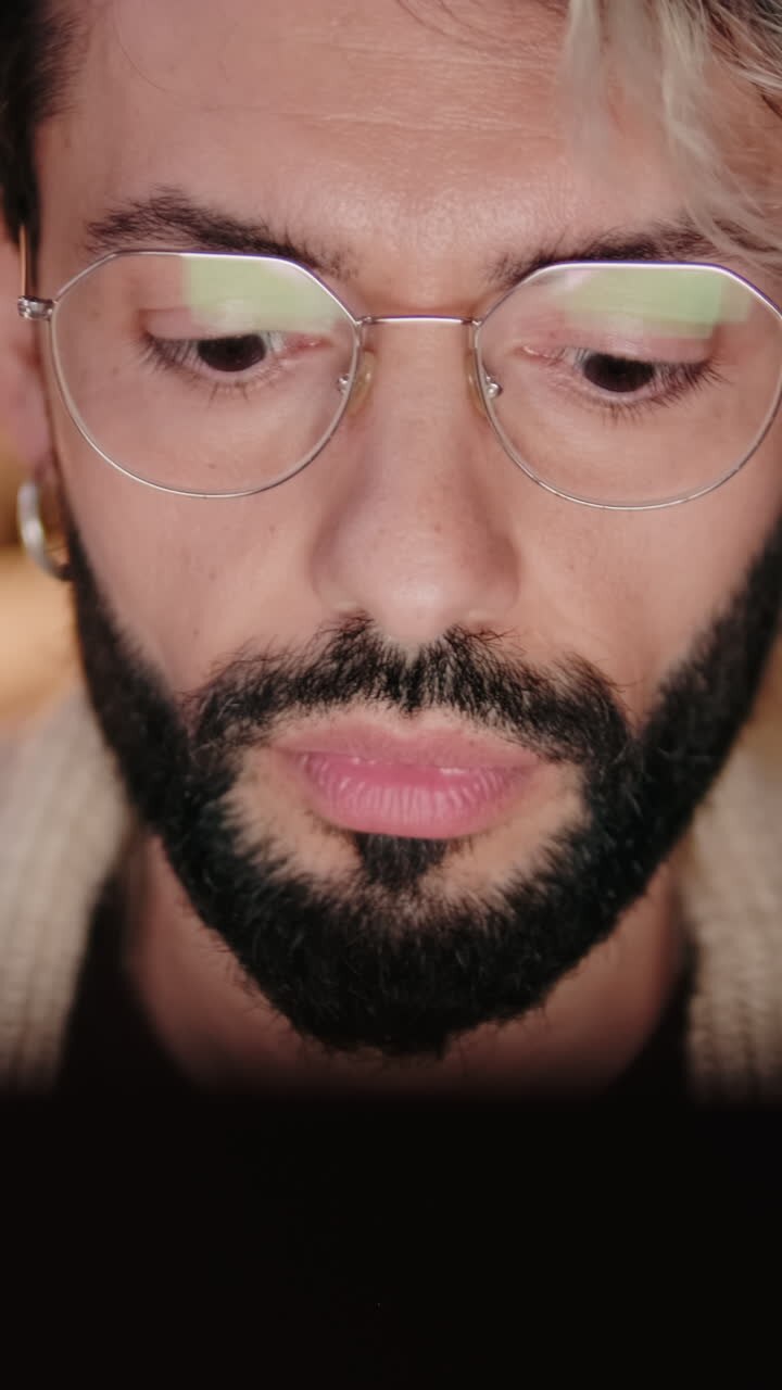 Gay Couple Working From Home on Laptop