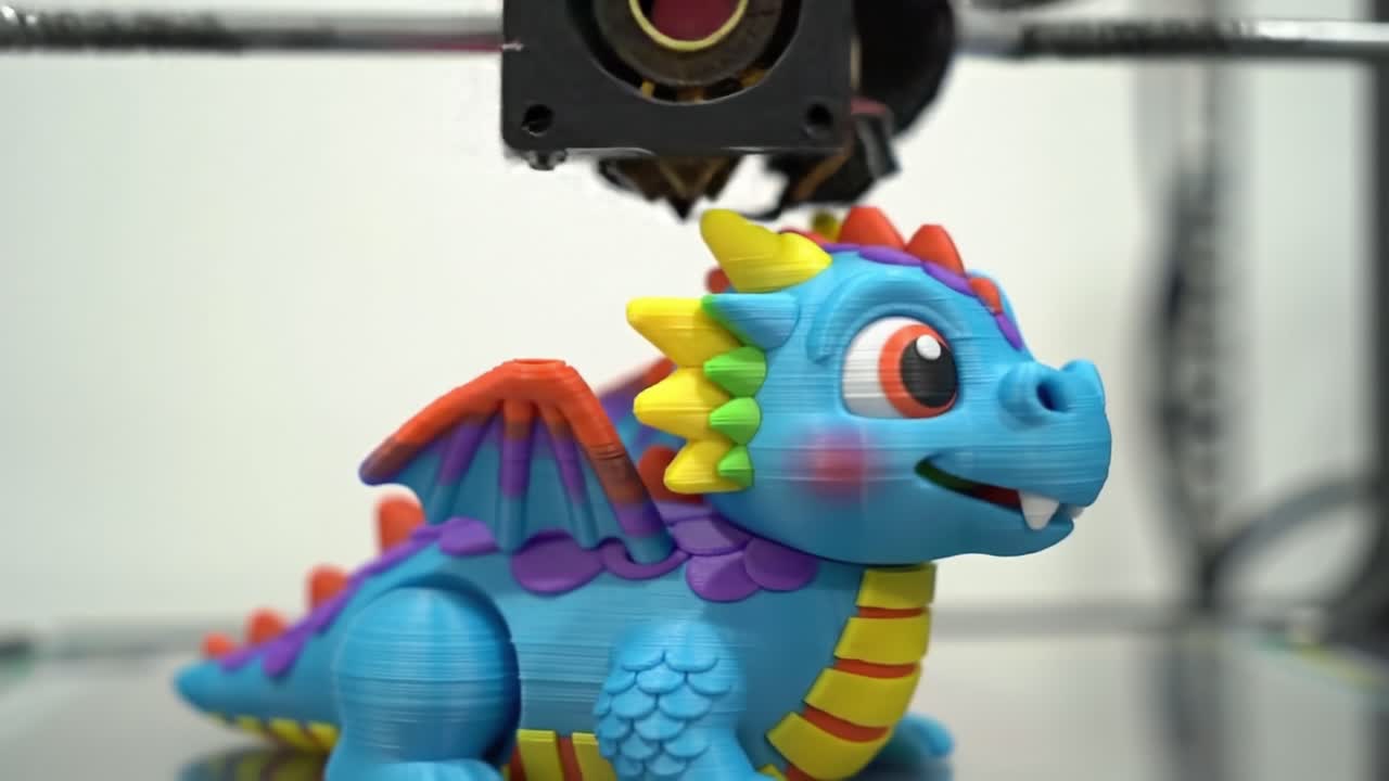 A Colorful 3D-Printed Dragon Toy Captured in Two Frames, Showcasing the Printing Process and Detailed Features of the Playful Character in Bright Hues